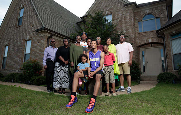 The foundation started by Gerald Hamilton (with glasses) has brought his family under scrutiny.
